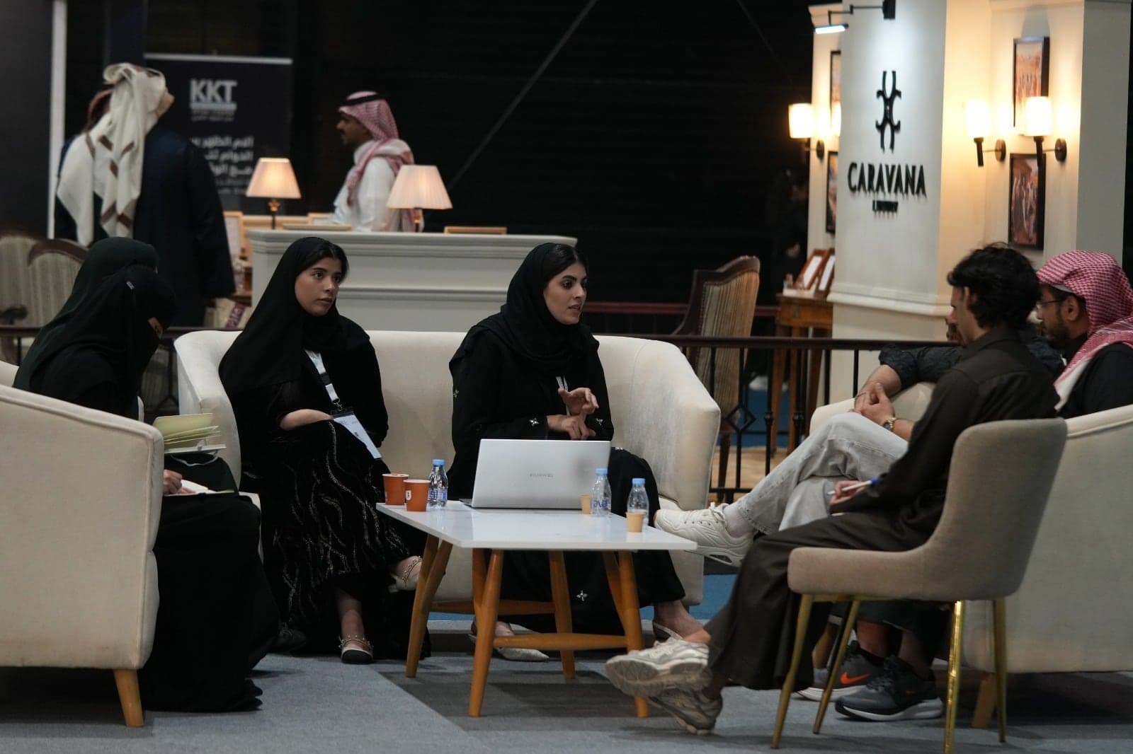 A team meeting with prospective partners in the seating lounge on the show floor